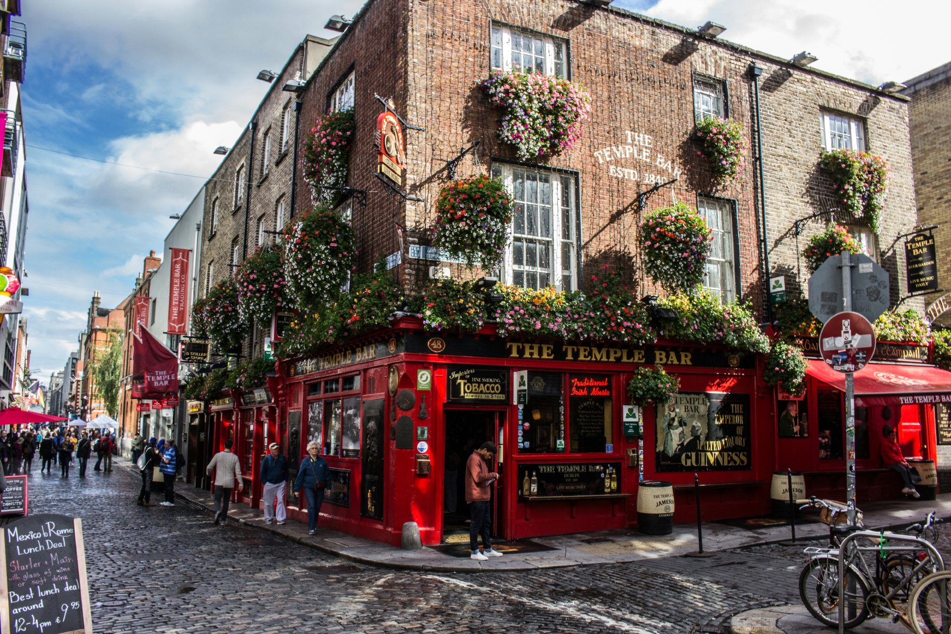 Red telephone box in front of The Temple Bar, Dublin